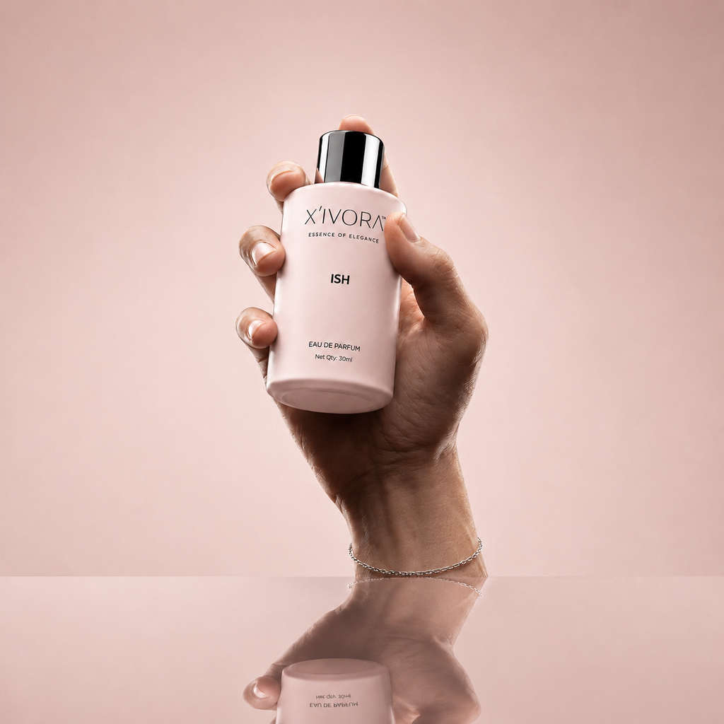 Hand holding XIVORA ISH Eau De Parfum bottle