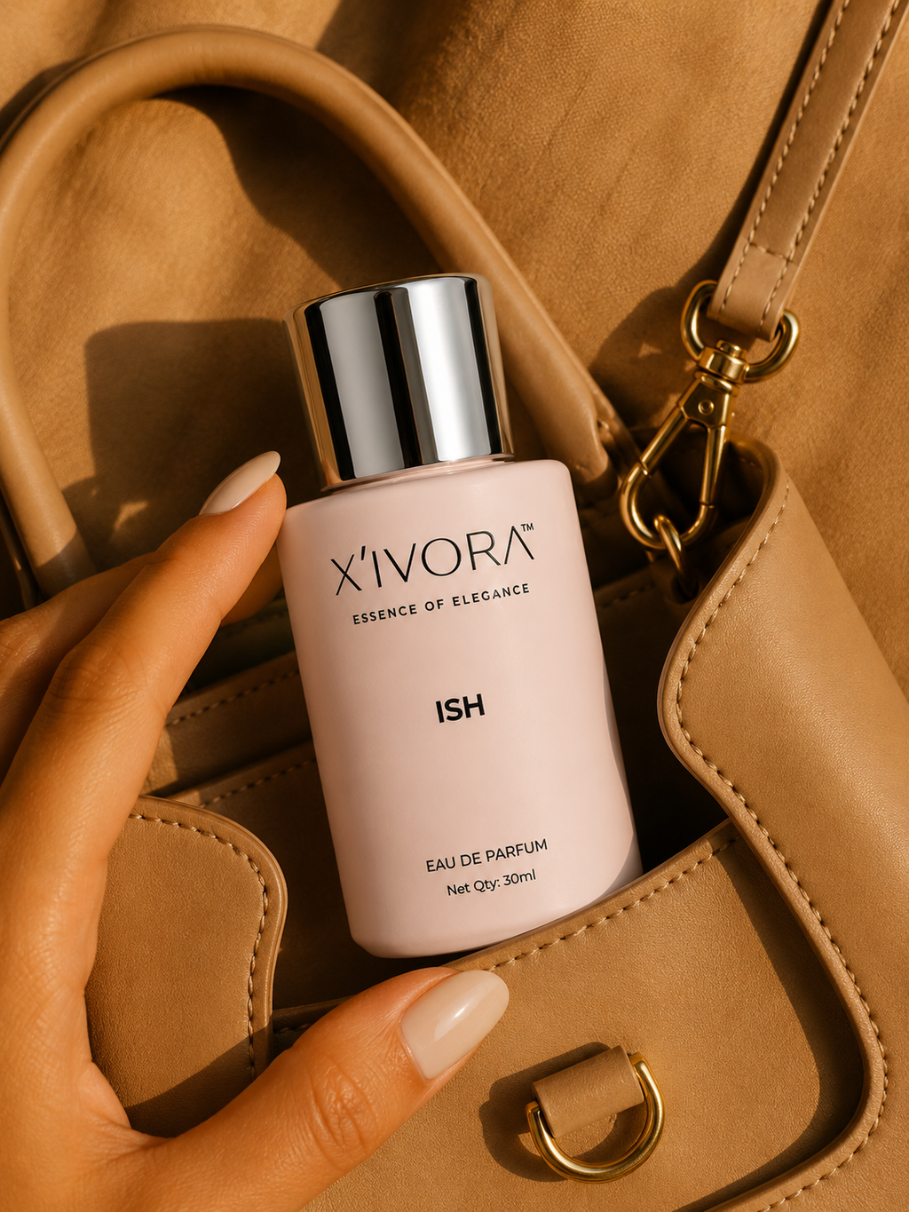 XIVORA ISH Eau De Parfum lifestyle image with luxury handbag