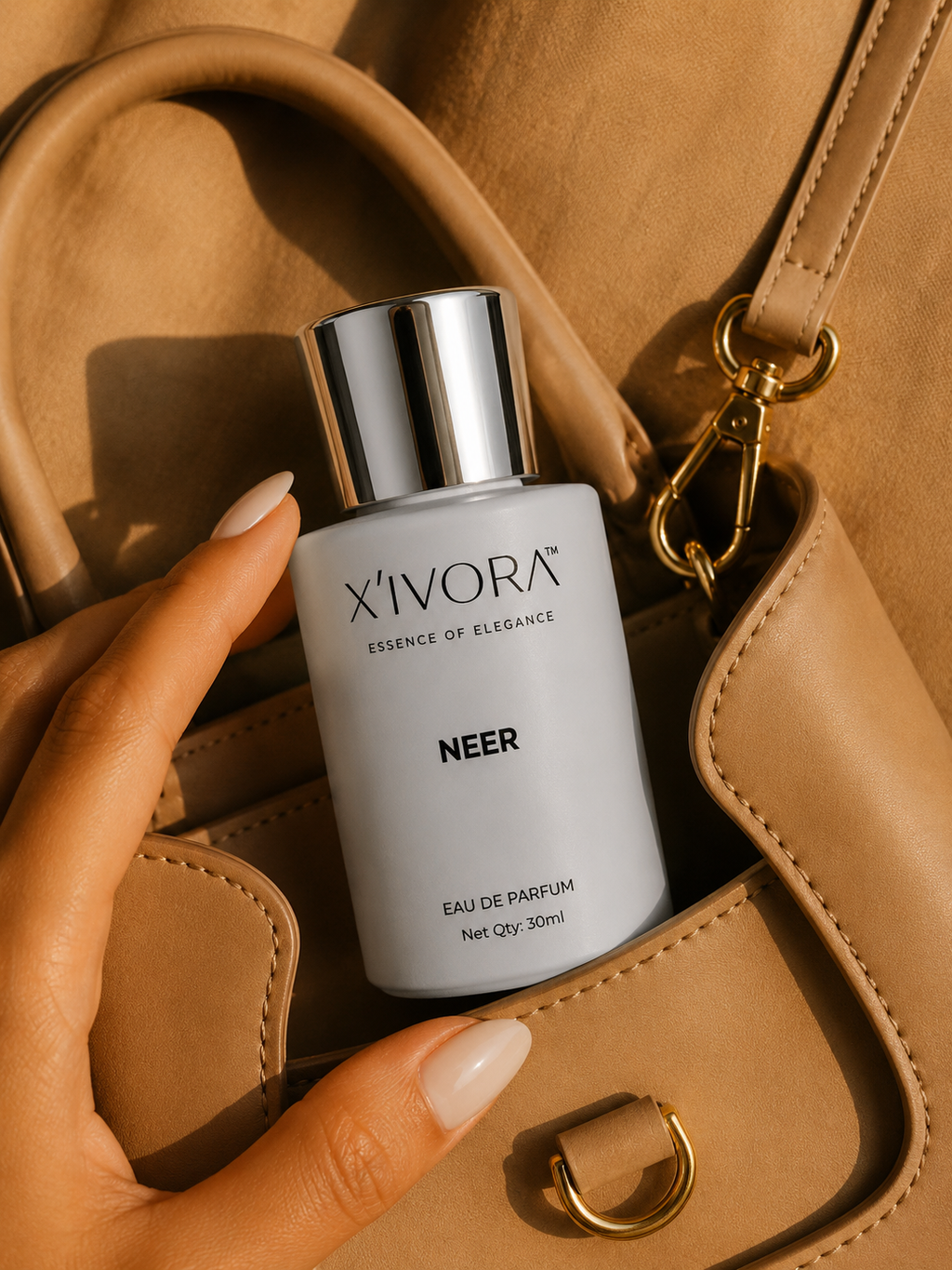 XIVORA NEER Eau De Parfum lifestyle image with luxury handbag