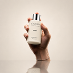 Hand holding XIVORA NIVRA Eau De Parfum bottle