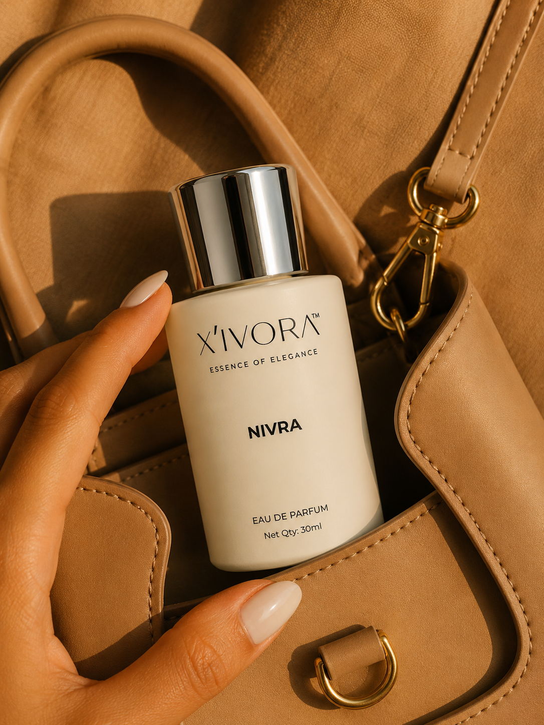 XIVORA NIVRA perfume placed inside luxury handbag