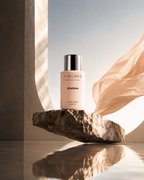XIVORA SPARSHA perfume with silk fabric and stone platform
