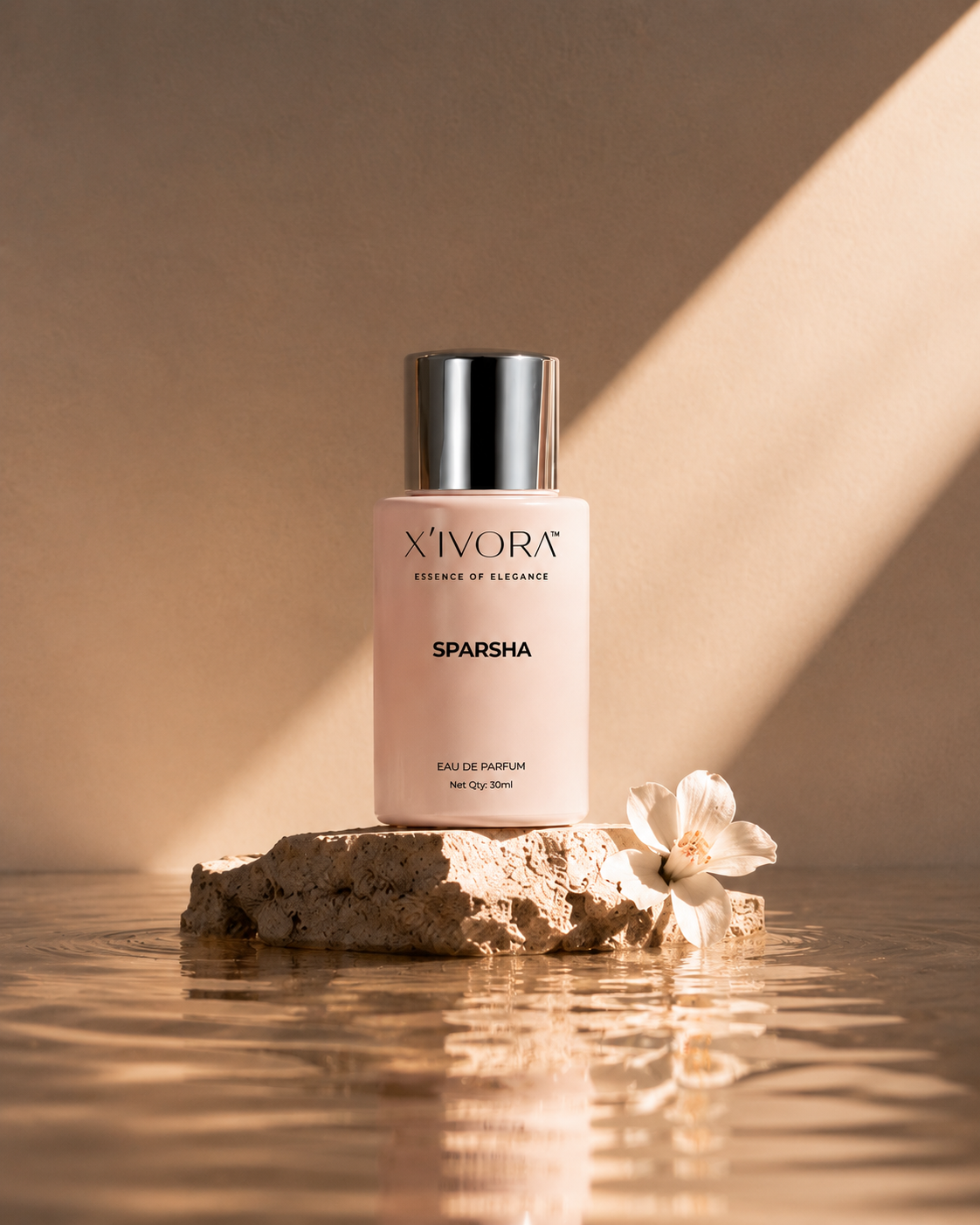 XIVORA SPARSHA perfume with flower and water reflection