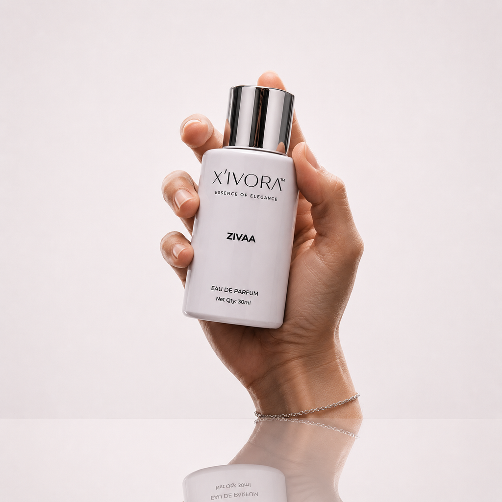 Hand holding XIVORA ZIVAA Eau De Parfum bottle