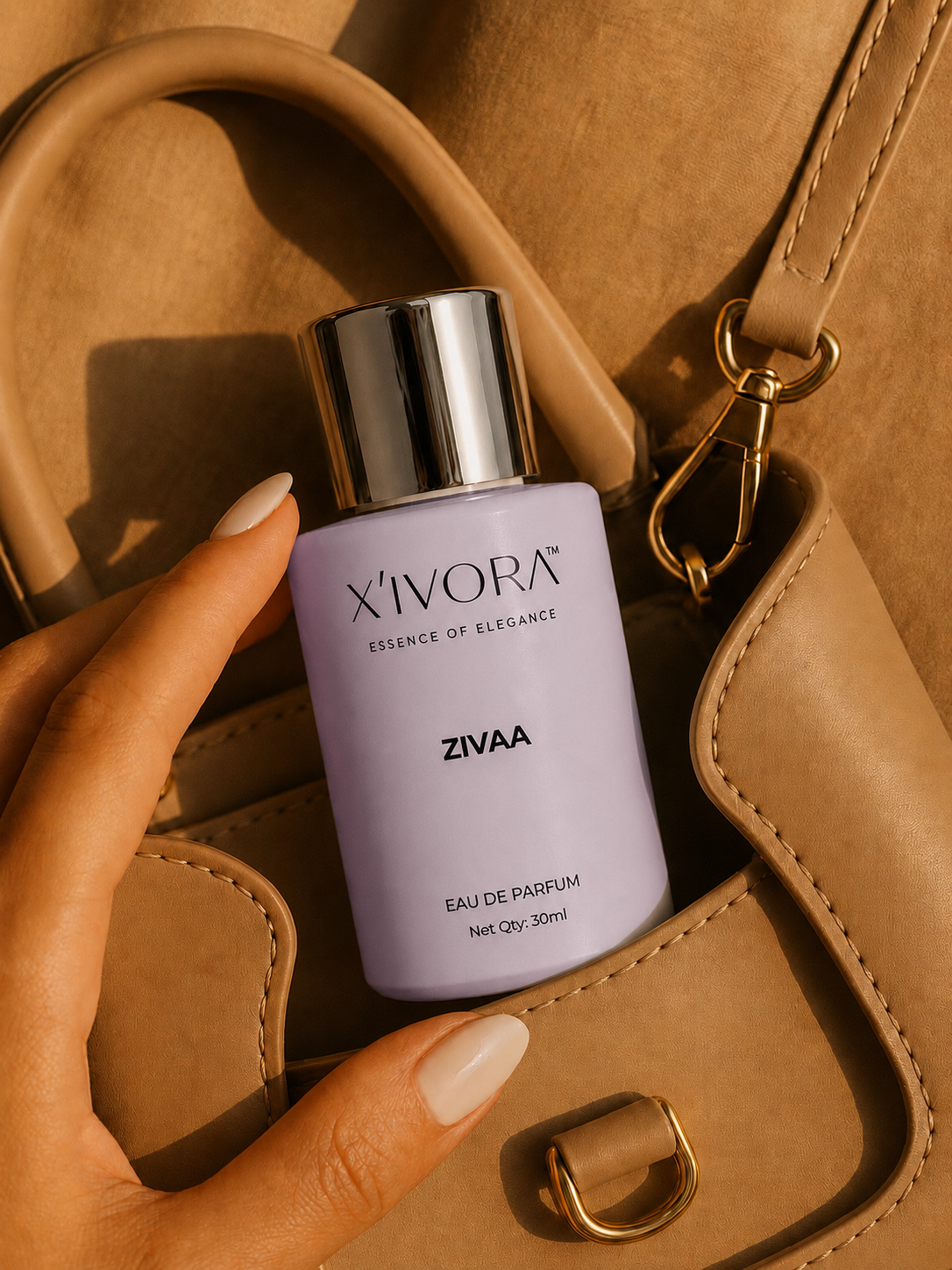 XIVORA ZIVAA perfume bottle inside luxury handbag